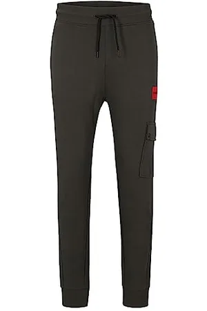HUGO BOSS Dwellrom Relaxed-Fit męskie spodnie do biegania z czerwonym logo, , M