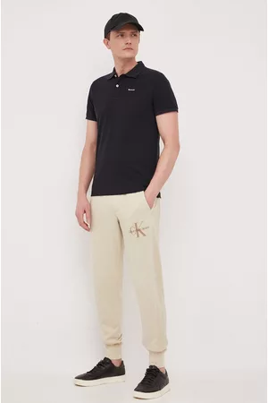 Calvin Klein Spodnie dresowe bawełniane kolor beżowy gładkie