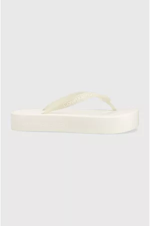 Calvin Klein Kobieta Sandały - Japonki BEACH SANDAL FLATFOR damskie kolor biały na platformie YW0YW01092