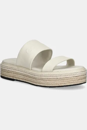 Calvin Klein Klapki skórzane FLATFORM WEDGE SLIDE - HE damskie kolor na platformie HW0HW02374