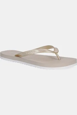 Calvin Klein Japonki THONG+ TPU METALLIC damskie kolor na płaskim obcasie YW0YW01720