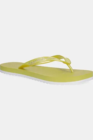 Calvin Klein Japonki THONG+ TPU METALLIC damskie kolor na płaskim obcasie YW0YW01720