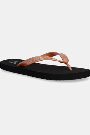 Calvin Klein Japonki BEACH SANDAL MONOLOGO TPU damskie kolor na płaskim obcasie YW0YW01719