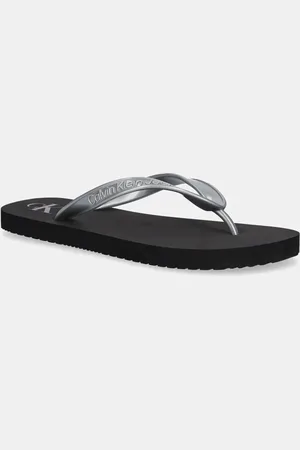 Calvin Klein Japonki BEACH SANDAL MONOLOGO TPU damskie kolor na płaskim obcasie YW0YW01719