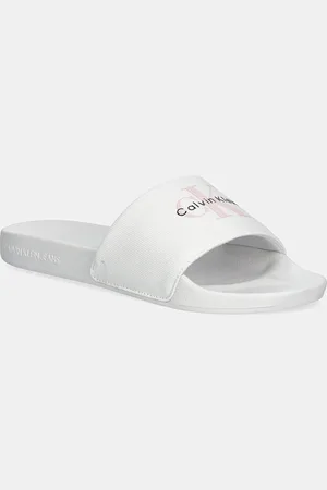 Calvin Klein Klapki SLIDE MONOGRAM WN LOGO CK damskie kolor YW0YW01967