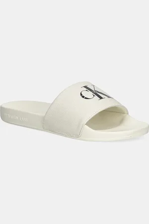 Calvin Klein Klapki SLIDE MONOGRAM WN LOGO CK damskie kolor YW0YW01967