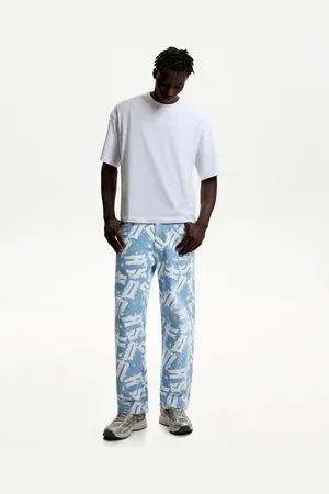 Bershka Jeansy Baggy Z Nadrukiem Mężczyzna 34