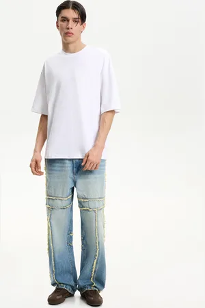 Bershka Jeansy Baggy Z Frędzlami Mężczyzna 32