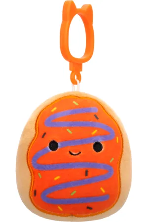 SQUISHMALLOWS Clip-On Pomarańczowy pączek z lukrem i fioletowym bazgrołem Jay, 9 cm