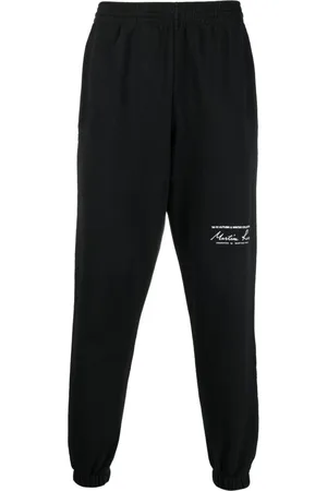 MARTINE ROSE Logo-print slim-fit track pants