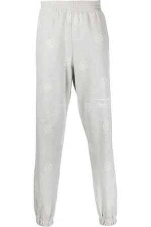 MARTINE ROSE Logo pattern track pants