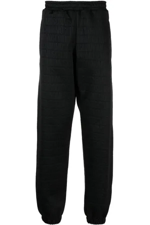 Moschino All-over logo-print track pants