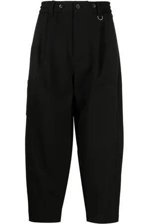 SONGZIO Logo-embroidered pleated drop-crotch trousers