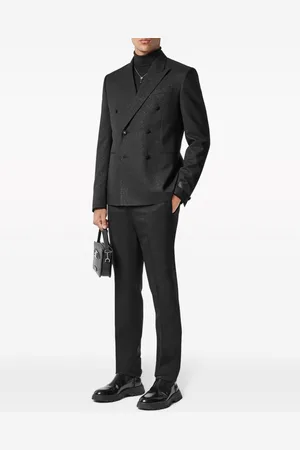 VERSACE Patterned-jacquard tapered-leg trousers