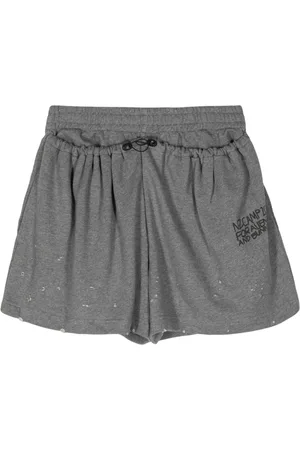 Natasha Zinko Slogan-print distressed track shorts
