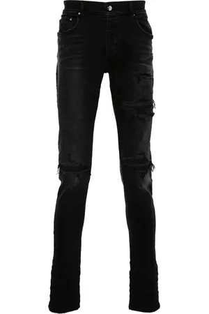 AMIRI Distressed skinny jeans