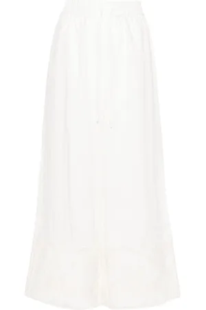 ALÉMAIS Pegasus-embroidered linen trousers