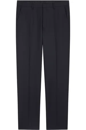 DRIES VAN NOTEN Pressed-crease tapered trousers