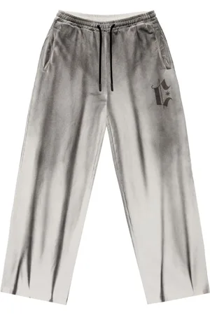 MARCELO BURLON Spray-effect track pants