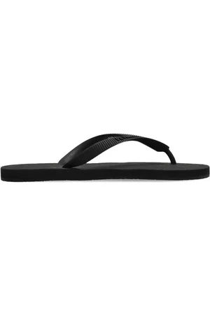 Vetements Embossed logo flip flops