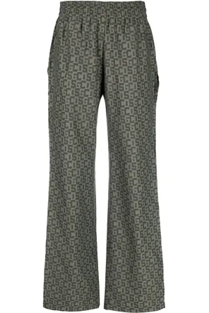GCDS Open-leg monogram trousers