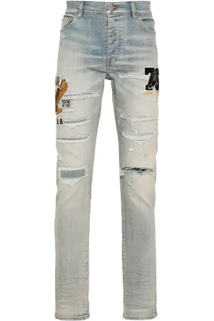 AMIRI Logo-appliqué skinny jeans