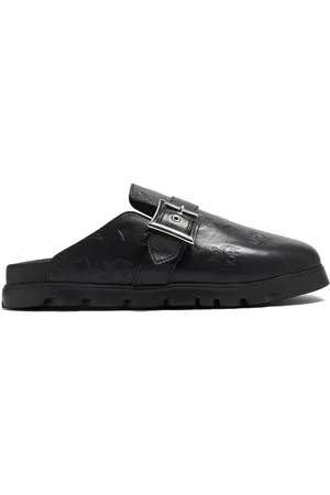MCM Monogram leather flat mules