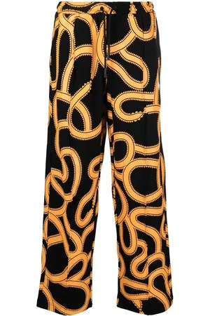 MARCELO BURLON Snake-print track pants