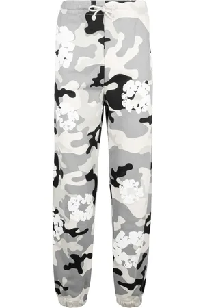 DENIM TEARS Camouflage-print trousers