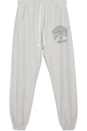 SAINT MXXXXXX Slogan-printed track pants