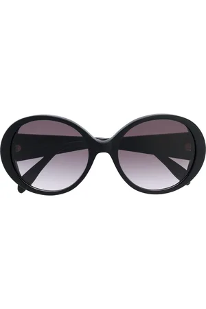 Alexander McQueen Round frame oversized sunglasses with gold logo lettering