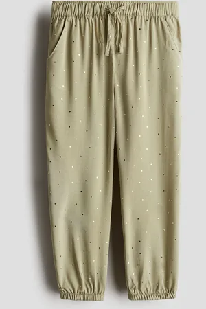 H&M Tkaninowe joggersy