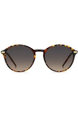 HUGO BOSS Okrągłe okulary przeciwsłoneczne z acetatu w kolorze Havana z zausznikami w złotej tonacji