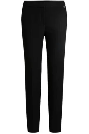 HUGO BOSS Spodnie o wąskim kroju z elastycznego materiału i ozdobione nitem z logo