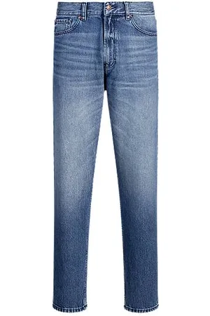 HUGO BOSS Jeansy o swobodnym, zwężanym kroju z niebieskiego denimu w odcieniu vintage