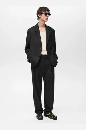 MANGO Spodnie garniturowe relaxed fit z zaszewkami