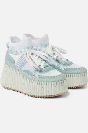 Chloé ChloÃ© Nama 80 suede-trimmed wedge sneakers