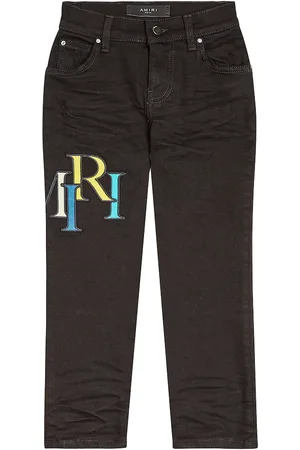 AMIRI Distressed logo skinny jeans