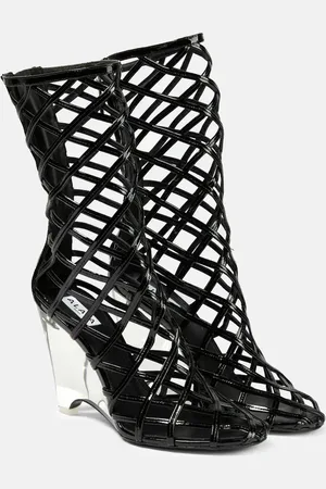 Alaïa AlaÃ¯a Leather wedge ankle boots