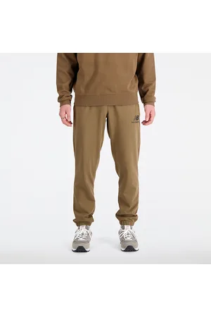New Balance Spodnie męskie MP31539DHE – brązowe
