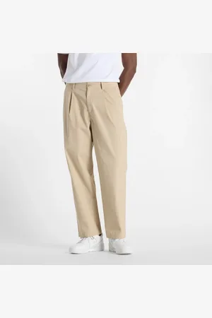New Balance Spodnie męskie MP51563SOT – beżowe