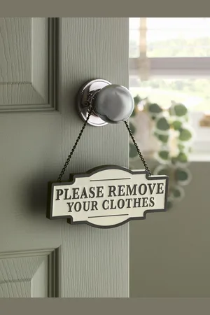 Next Remove Your Clothes Slogan SignJeden