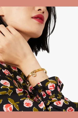 Kate Spade Gold Tone Charm BraceletJeden