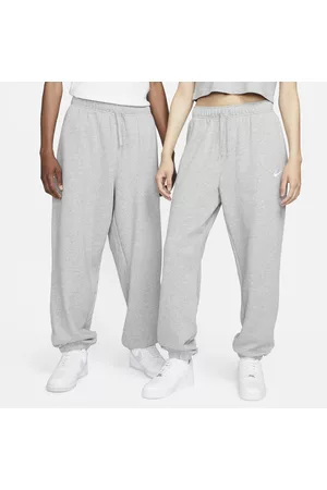Nike Kobieta Dresy Zimowe - Damskie spodnie dresowe o kroju oversize ze średnim stanem Sportswear Club Fleece