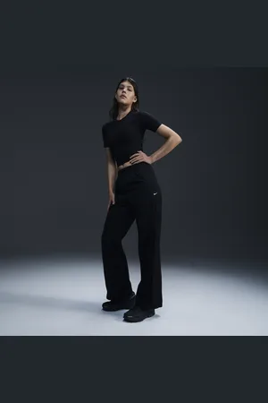 Nike Damskie spodnie z tkaniny z wysokim stanem i luźnymi nogawkami Windrunner