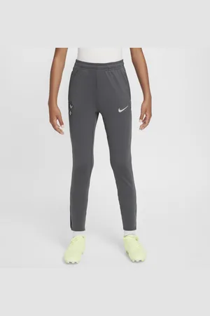 Nike Dzianinowe spodnie piłkarskie dla dużych dzieci Dri-FIT Tottenham Hotspur Strike