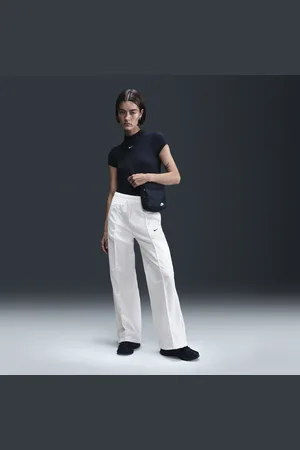 Nike Damskie spodnie ze średnim stanem i luźnymi nogawkami Sportswear Everything Wovens