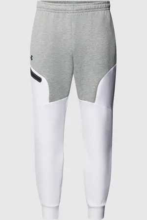 Under Armour Spodnie dresowe o dwukolorowym designie model ‘Unstoppable’