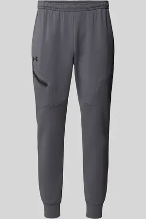 Under Armour Spodnie dresowe o kroju regular fit z kieszenią zapinaną na zamek błyskawiczny model ‘UNSTOPPABLE’