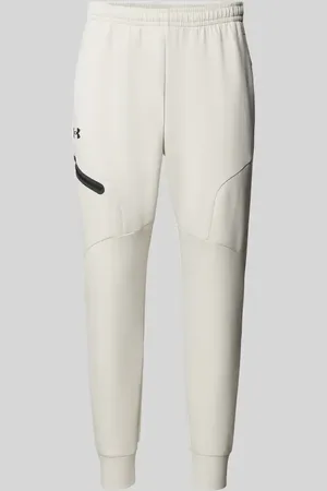 Under Armour Spodnie dresowe o kroju regular fit z kieszenią zapinaną na zamek błyskawiczny model ‘UNSTOPPABLE’